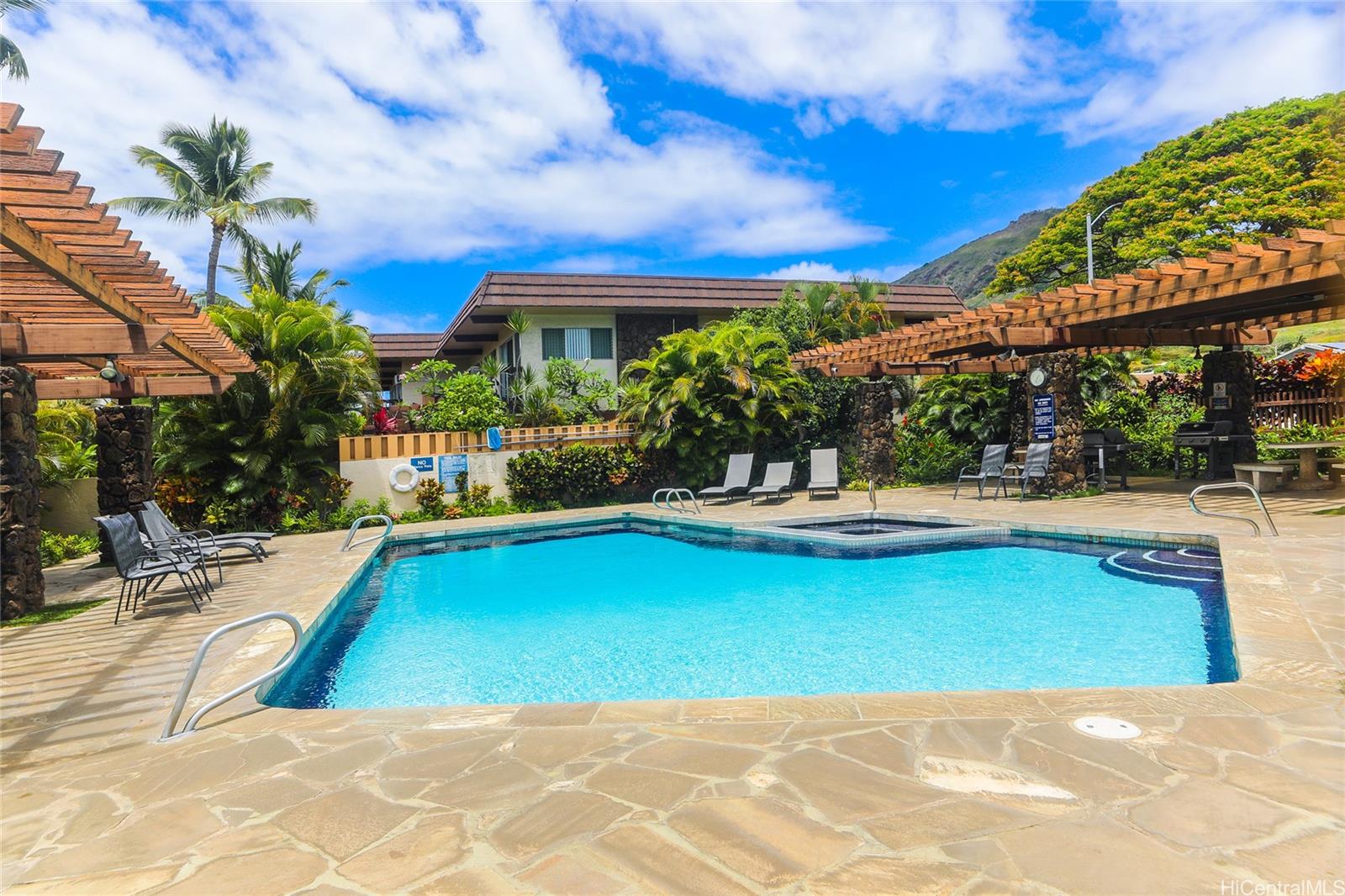 444 Lunalilo Home Road, Unit 312 Honolulu, HI 96825 - Photo 24 of 25 a view of swimming pool with outdoor seating and a patio