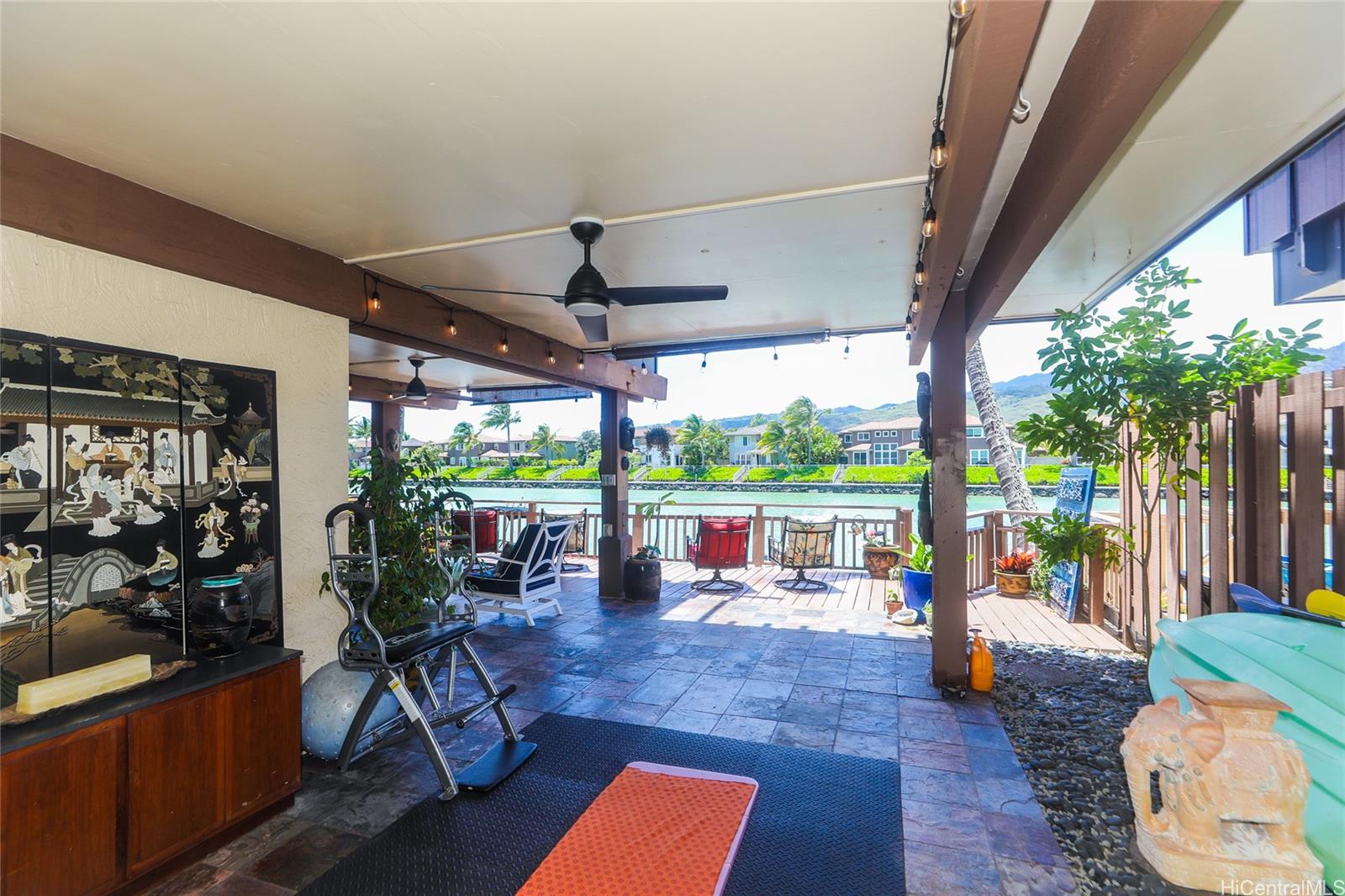 444 Lunalilo Home Road, Unit 312 Honolulu, HI 96825 - Photo 8 of 25 a living room with patio furniture and a floor to ceiling window