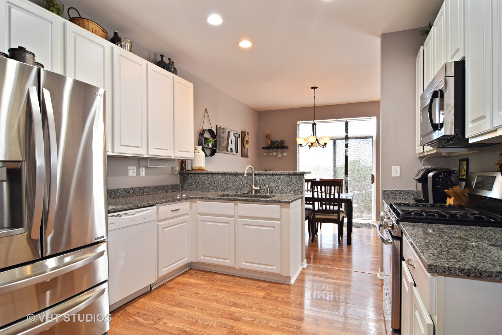255 Grand Ridge Road St. Charles, IL 60175 - Photo 6 of 14 a kitchen with stainless steel appliances granite countertop a sink stove and refrigerator