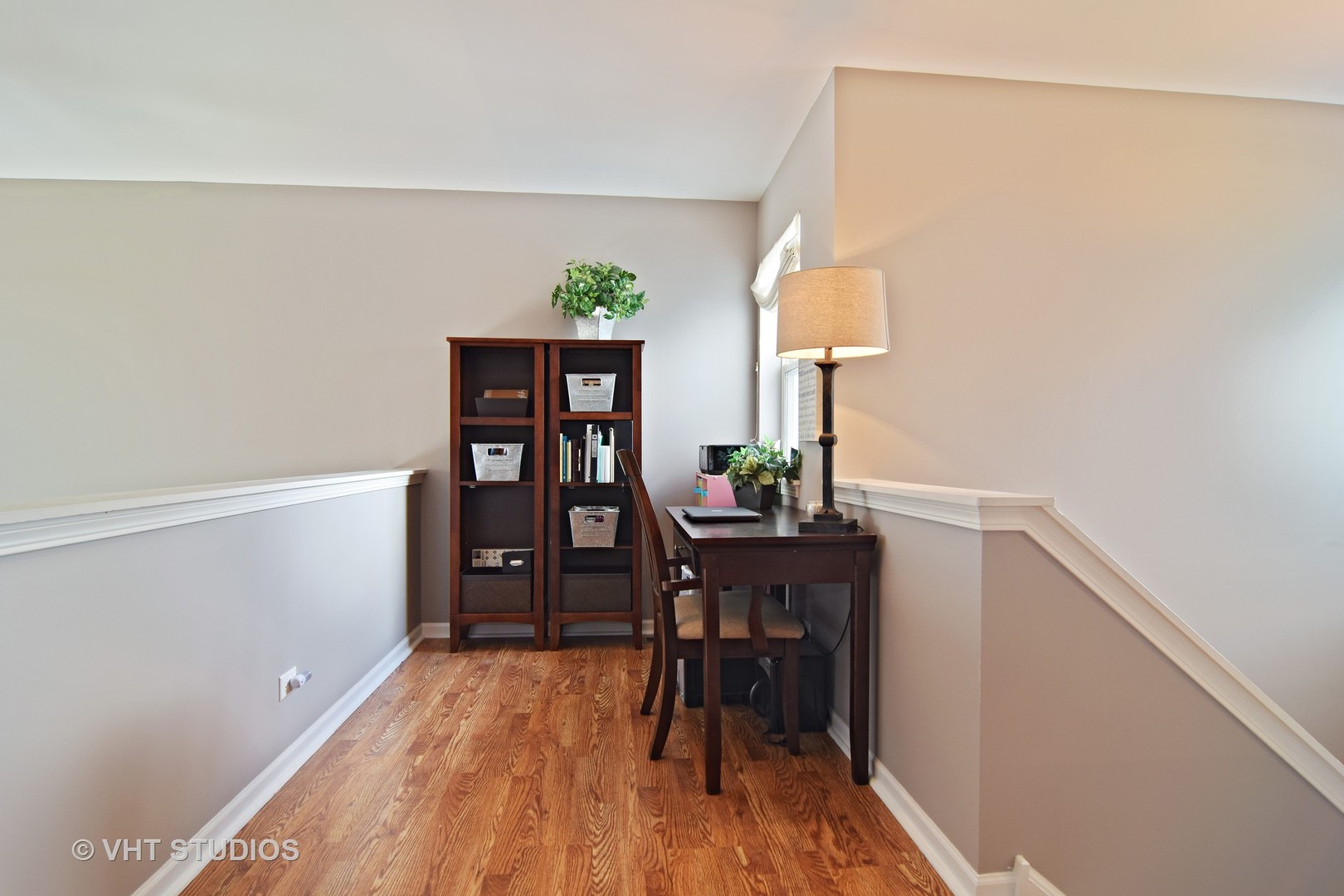 255 Grand Ridge Road St. Charles, IL 60175 - Photo 8 of 14 a view of a workspace with furniture and wooden floor