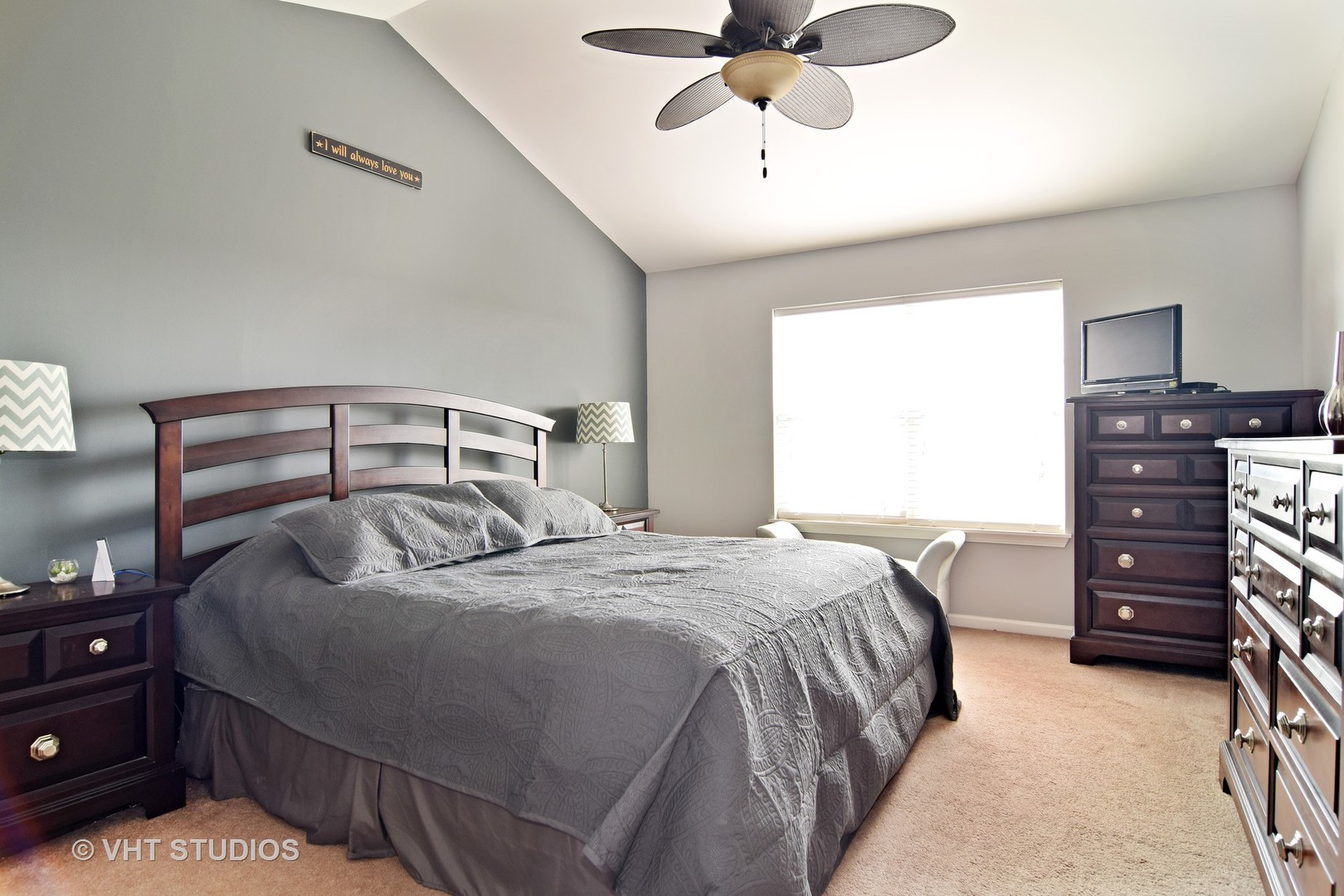 255 Grand Ridge Road St. Charles, IL 60175 - Photo 9 of 14 a bedroom with a bed and a chandelier