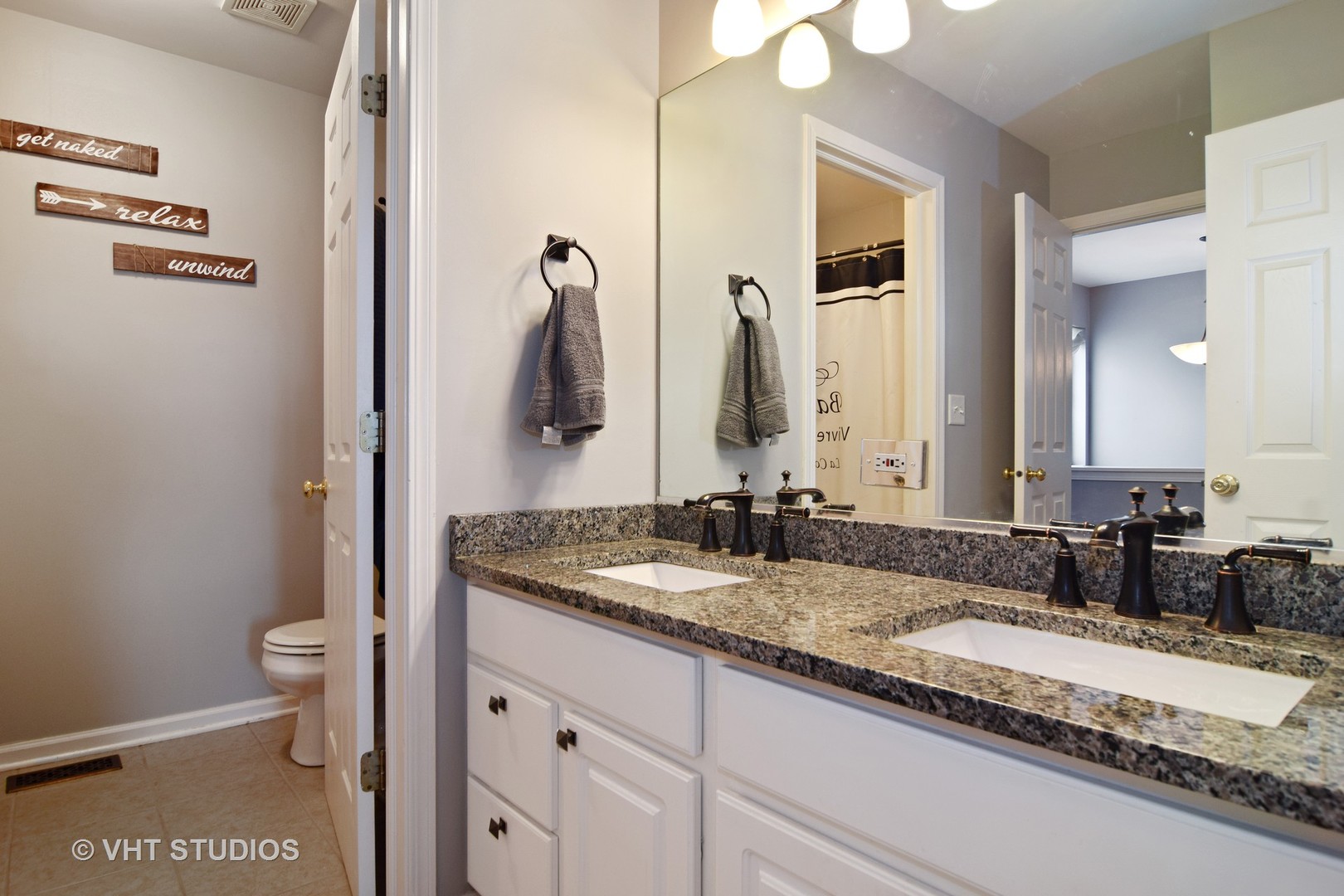 255 Grand Ridge Road St. Charles, IL 60175 - Photo 10 of 14 a bathroom with a granite countertop sink and a mirror