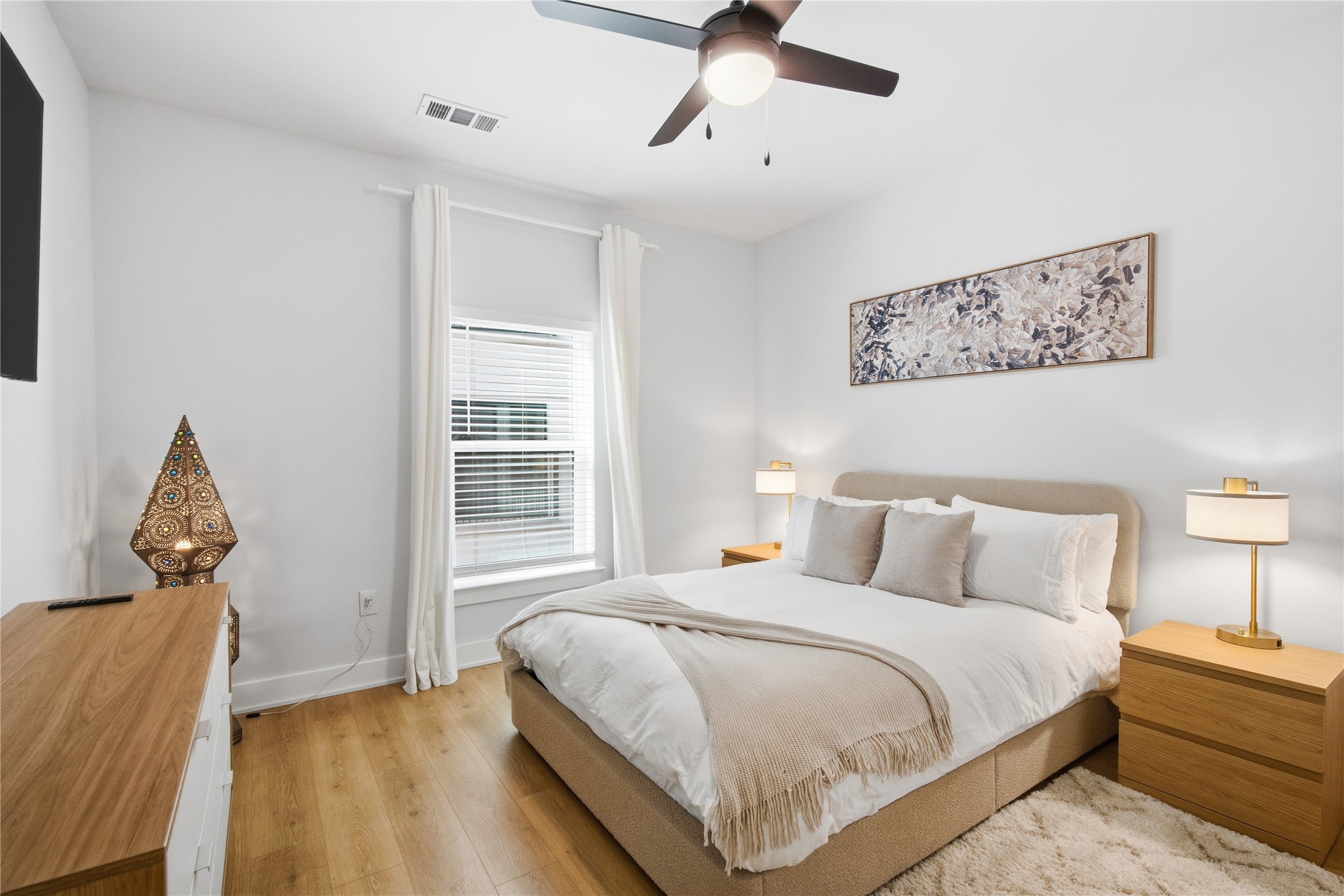 2500 Longview Street, Unit 219 Austin, TX 78705 - Photo 5 of 40 Bedroom featuring light wood-type flooring and ceiling fan