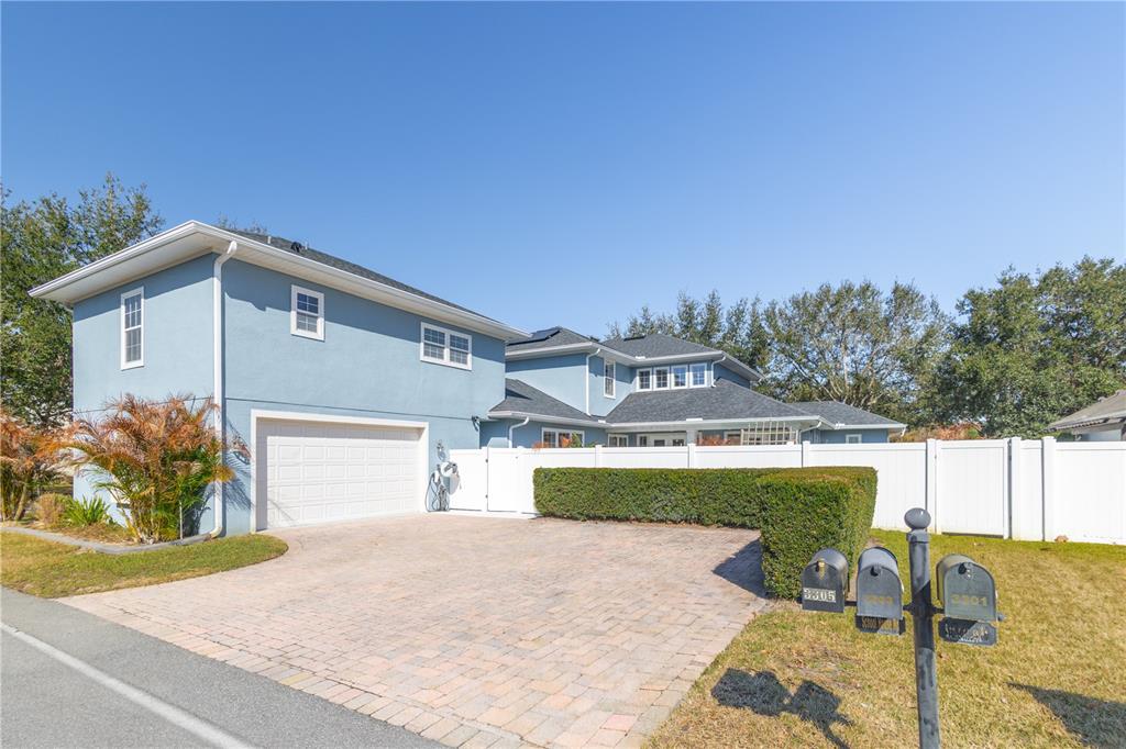 3305 Schoolhouse Road St. Cloud, FL 34773 - Photo 49 of 83 a front view of a house with a yard