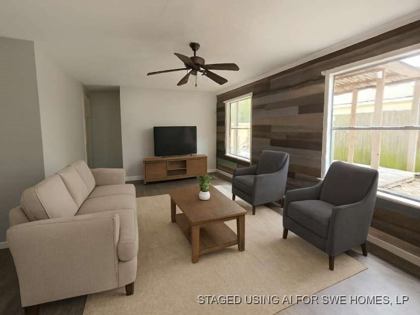 1110 Greencroft Street Channelview, TX 77530 - Photo 3 of 5 a living room with furniture a flat screen tv and a large window