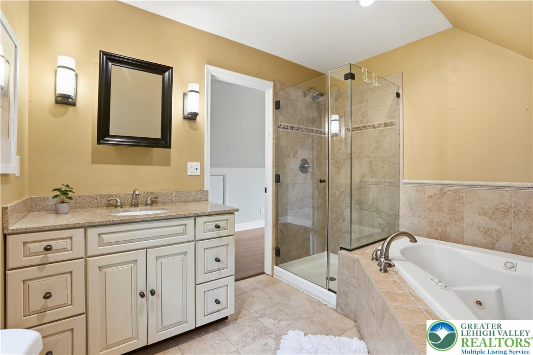 2014 Linden Street Bethlehem, PA 18017 - Photo 36 of 85 Luxurious bathroom retreat featuring a spacious jetted tub and a modern walk-in shower.