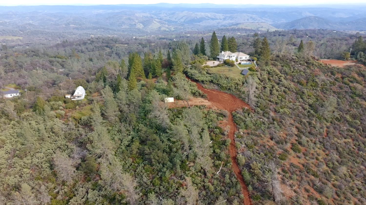 4086 Pilot View Court Pilot Hill, CA 95664 - Photo 9 of 34 a view of a forest with mountains in the background