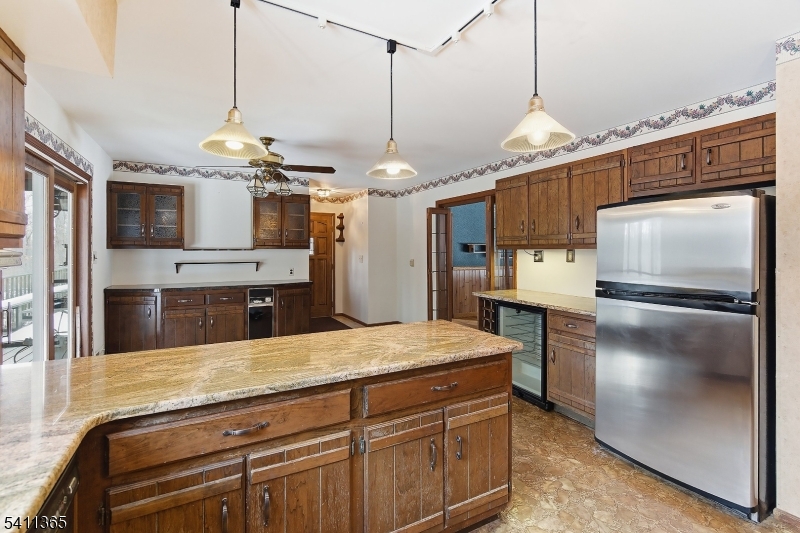 439 Long Hill Road Hillsborough, NJ 08844 - Photo 20 of 41 a kitchen with kitchen island a counter top space stainless steel appliances and cabinets