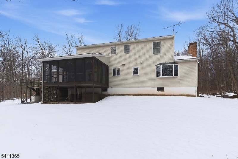 439 Long Hill Road Hillsborough, NJ 08844 - Photo 35 of 41 a view of house with a yard covered in snow