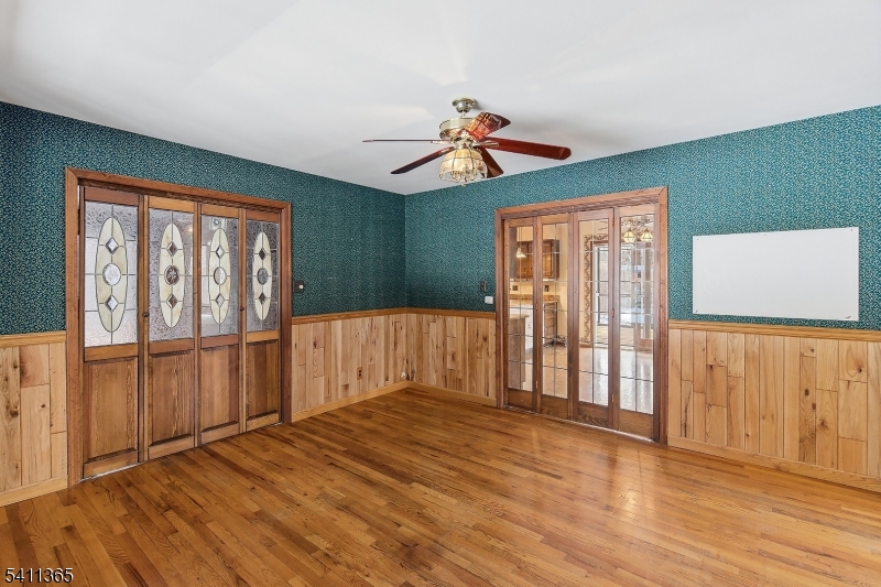 439 Long Hill Road Hillsborough, NJ 08844 - Photo 8 of 41 a view of empty room with wooden floor and fan