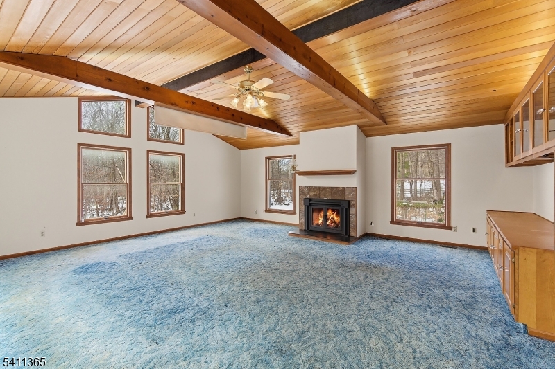 439 Long Hill Road Hillsborough, NJ 08844 - Photo 10 of 41 a view of an empty room with a fireplace and a window