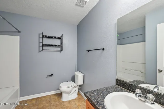 a view of a bathroom with a sink and a toilet