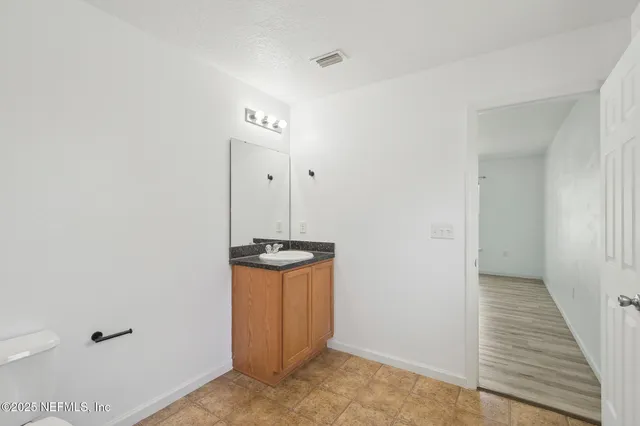 a view of room with stairs and a closet