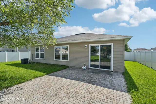 a view of a back yard of the house