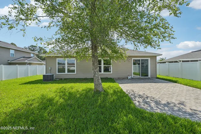 a view of a lake with houses in the back