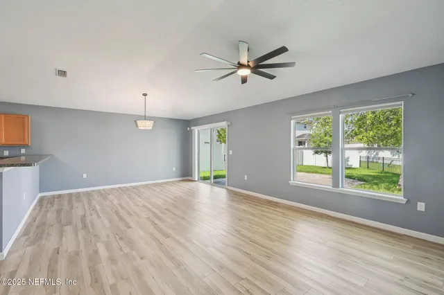 a kitchen with stainless steel appliances granite countertop a sink and a stove