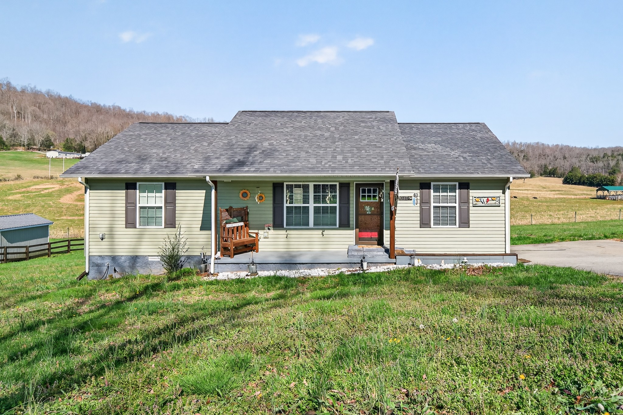 2040 Walker Cove Road Sparta, TN 38583 - Photo 1 of 26 a front view of a house with a yard and porch