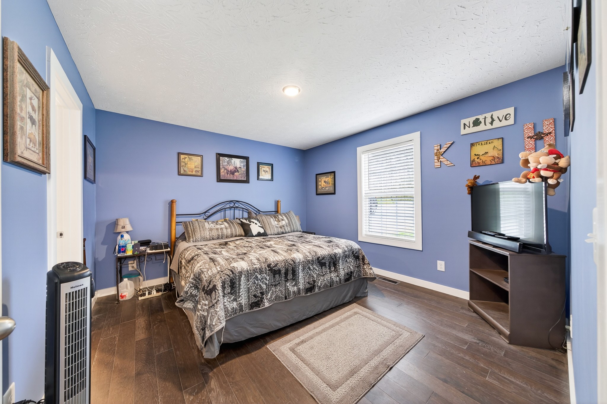 2040 Walker Cove Road Sparta, TN 38583 - Photo 10 of 26 a bedroom with a bed and a flat screen tv