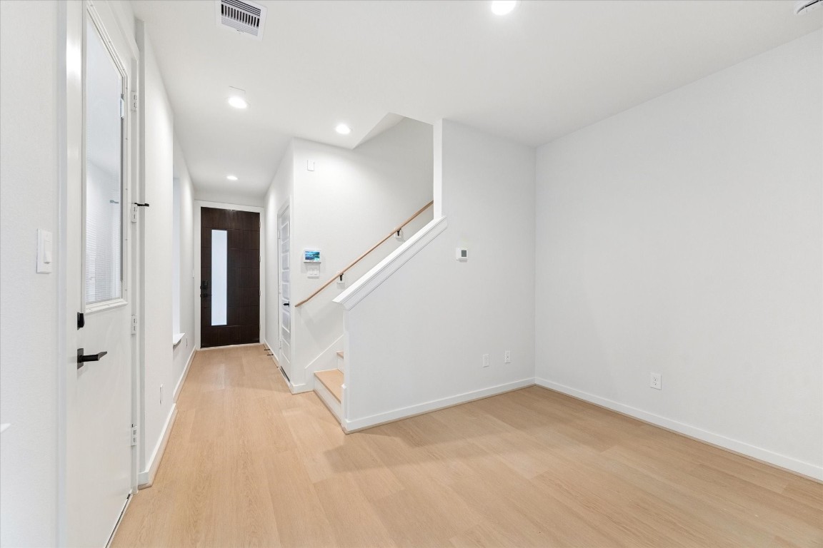 817 Thornton Road, Unit F Houston, TX 77018 - Photo 5 of 36 wooden floor in an empty room