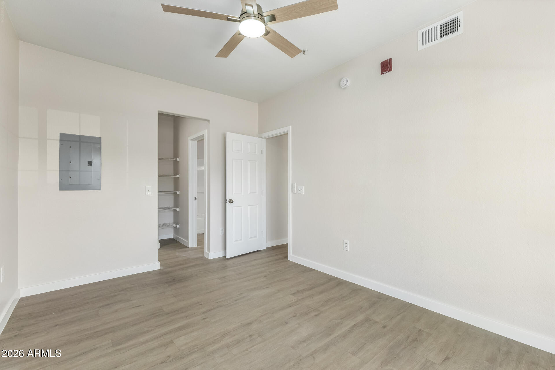 3434 East Baseline Road, Unit 109 Phoenix, AZ 85042 - Photo 14 of 40 a view of an empty room with wooden floor