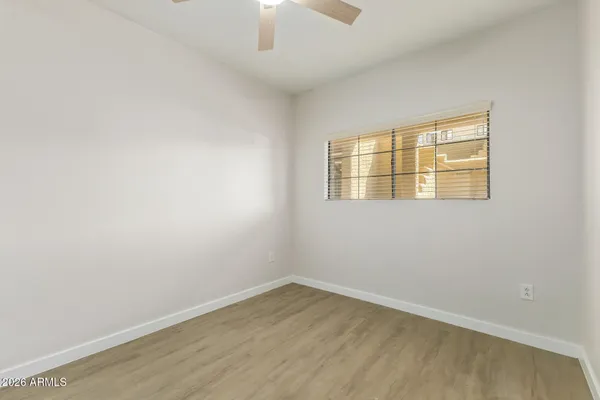 a white toilet sitting next to a bath tub