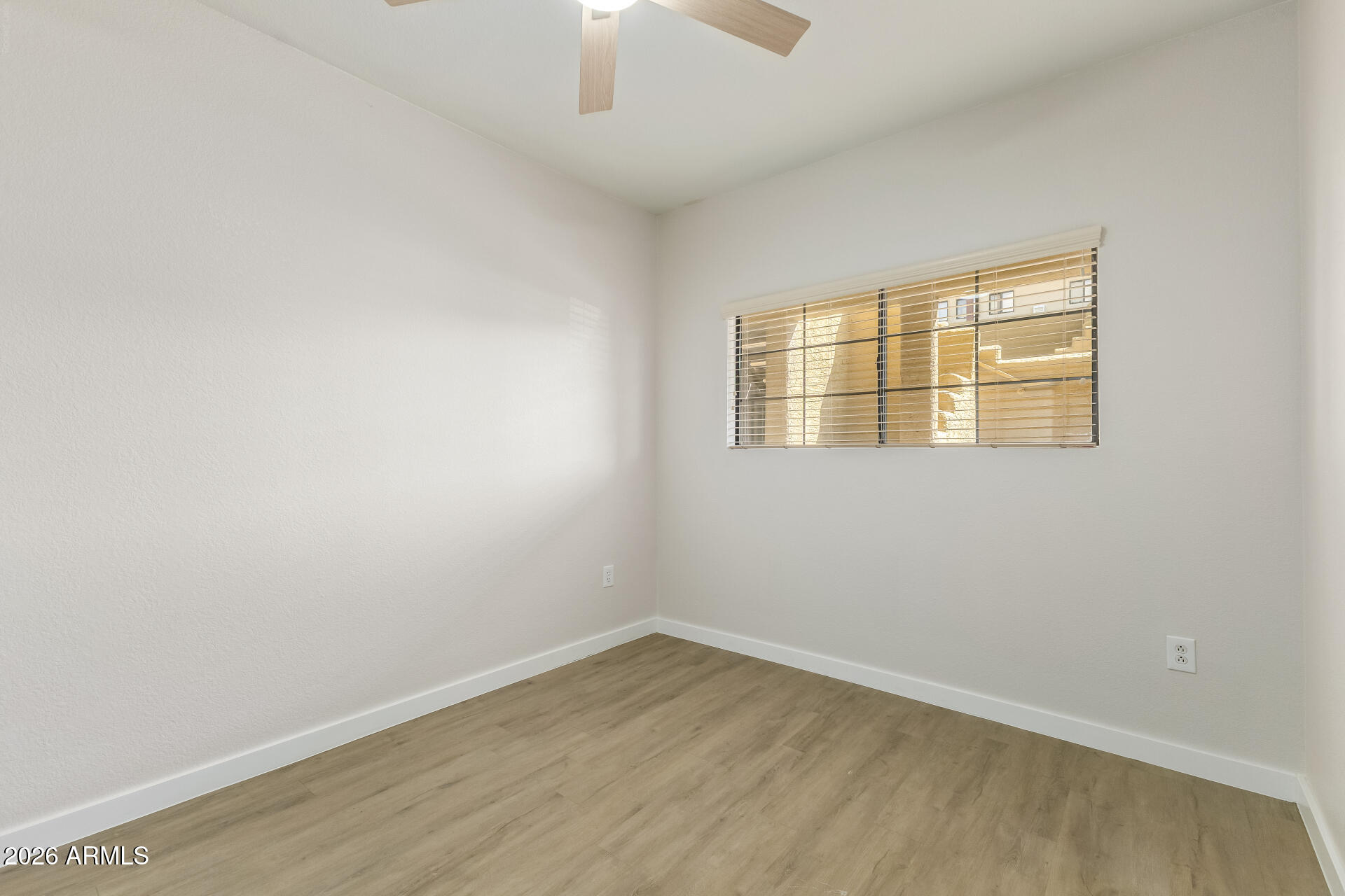 3434 East Baseline Road, Unit 109 Phoenix, AZ 85042 - Photo 20 of 40 an empty room with a window
