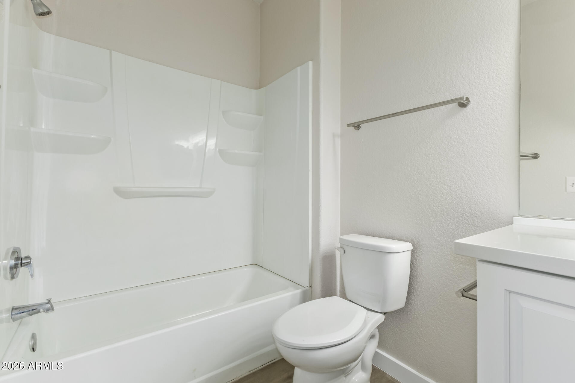 3434 East Baseline Road, Unit 109 Phoenix, AZ 85042 - Photo 21 of 40 a white toilet sitting next to a bath tub