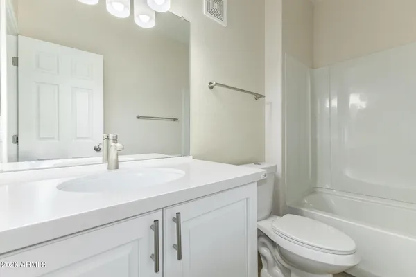a bathroom with a bathtub and a toilet