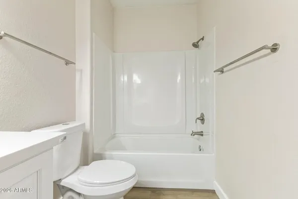 a view of washer and dryer with wooden floor