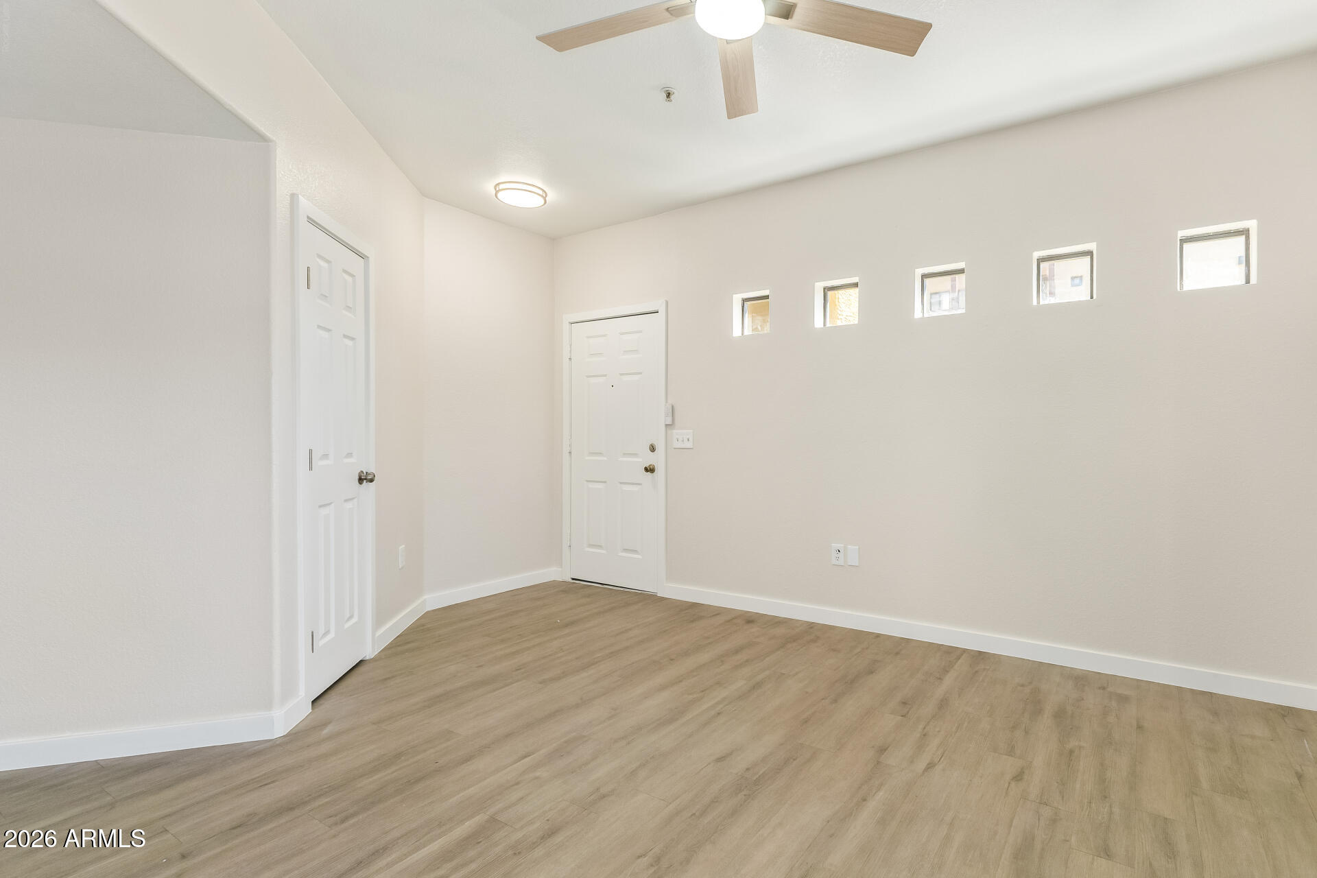 3434 East Baseline Road, Unit 109 Phoenix, AZ 85042 - Photo 6 of 40 wooden floor in an empty room