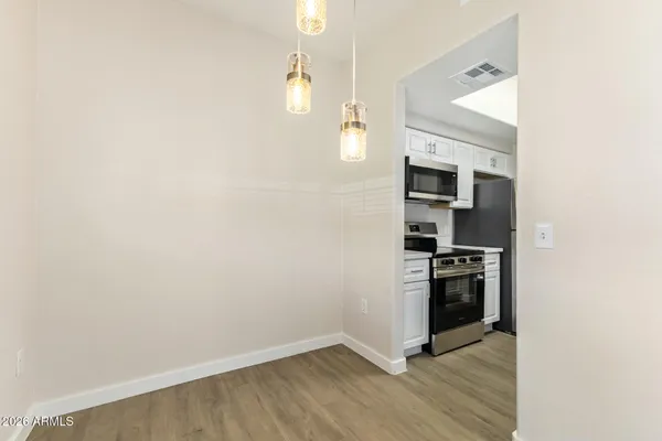 a view of a hallway with a window