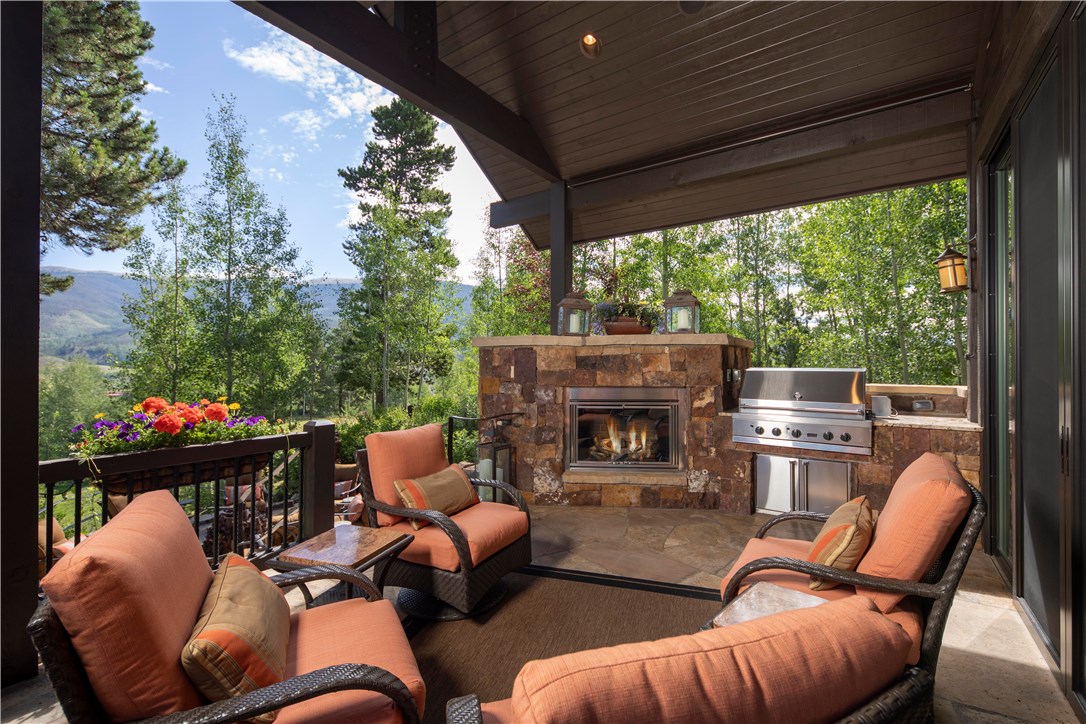 130 Hunter's Knob Road Silverthorne, CO 80498 - Photo 10 of 35 One of three outdoor fire features. This one is covered and has a sun shade for cozy evenings. A built in grill in the covered area is ideal for year round use.