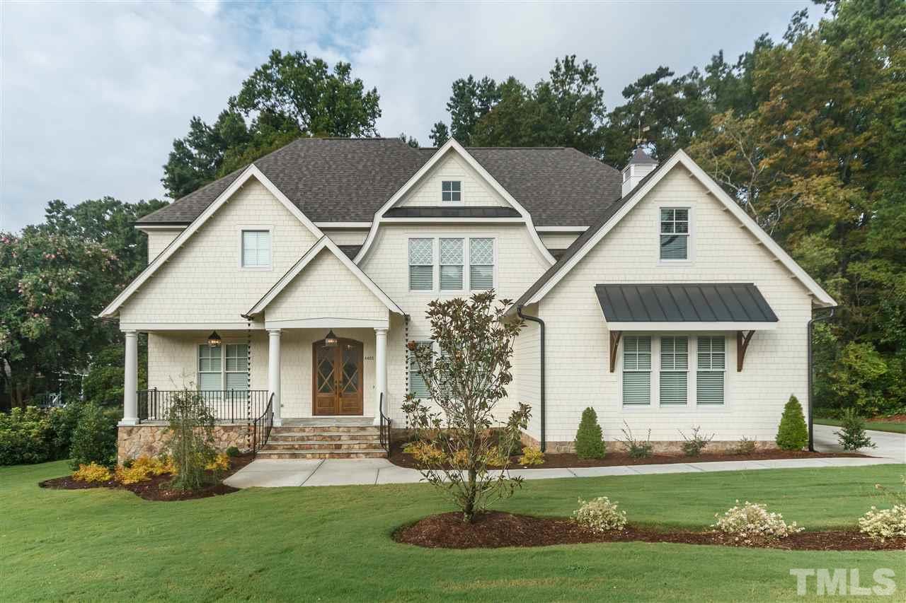 4405 Gates Street Raleigh, NC 27609 - Photo 1 of 18 a front view of a house with a yard