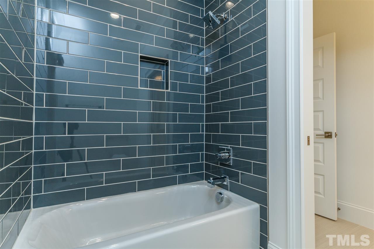 4405 Gates Street Raleigh, NC 27609 - Photo 13 of 18 a view of a bathtub in a bathroom