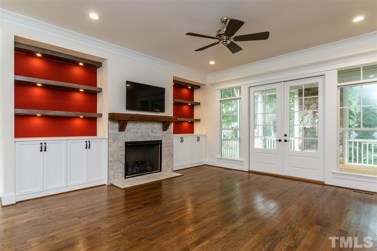 4405 Gates Street Raleigh, NC 27609 - Photo 6 of 18 a view of an empty room with a fireplace and a window