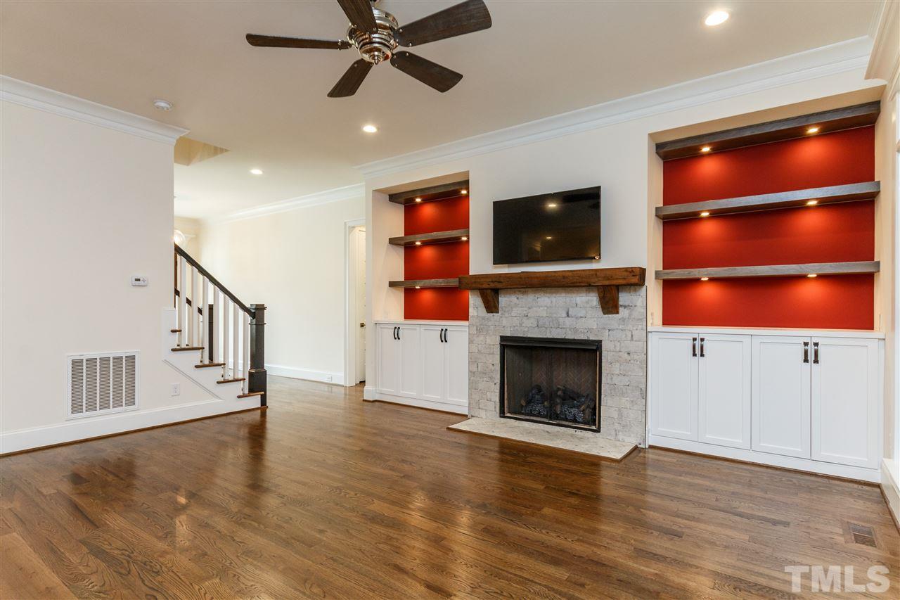 4405 Gates Street Raleigh, NC 27609 - Photo 7 of 18 a living room with furniture and a fireplace