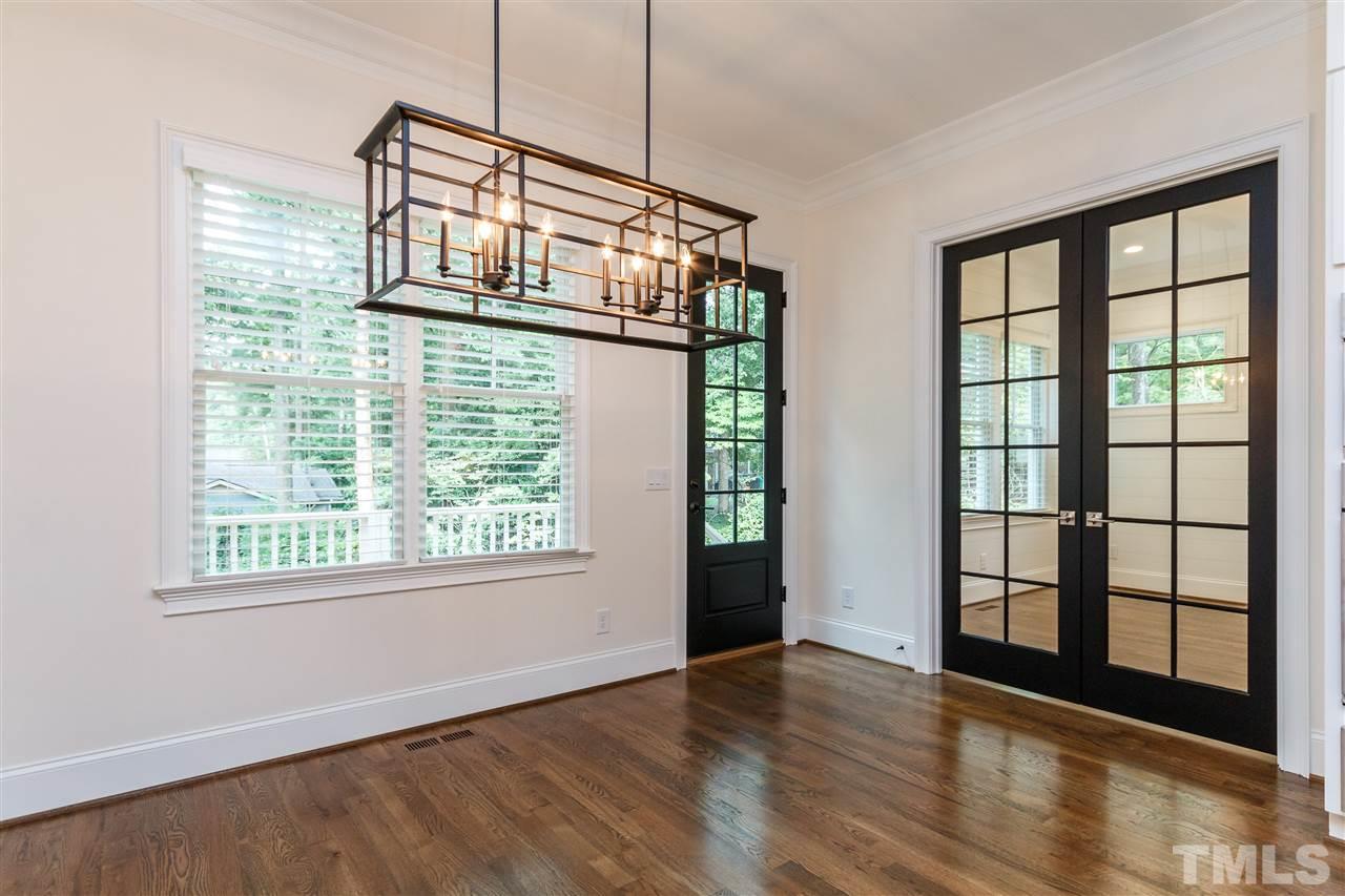 4405 Gates Street Raleigh, NC 27609 - Photo 8 of 18 a view of an empty room with wooden floor and a window
