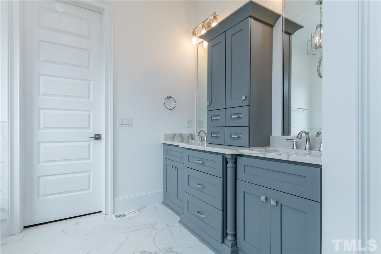 4405 Gates Street Raleigh, NC 27609 - Photo 10 of 18 a bathroom with a granite countertop sink double and mirror