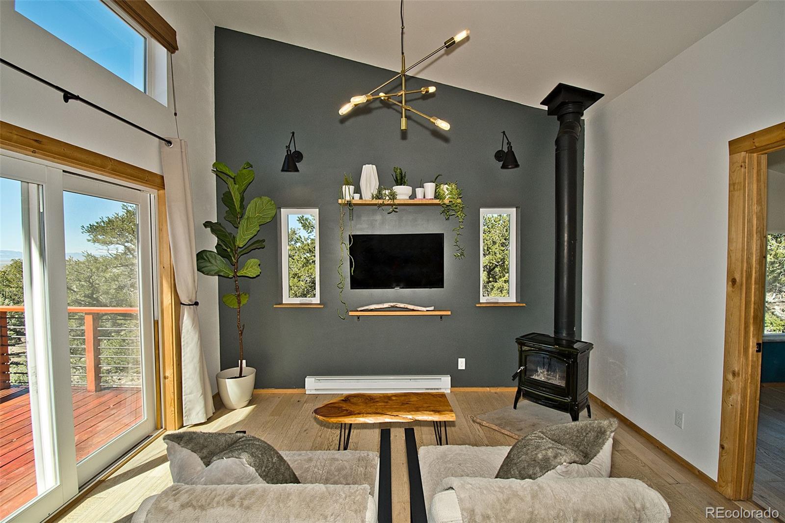4352 Rarity Way Crestone, CO 81131 - Photo 17 of 49 a living room with furniture and a fireplace