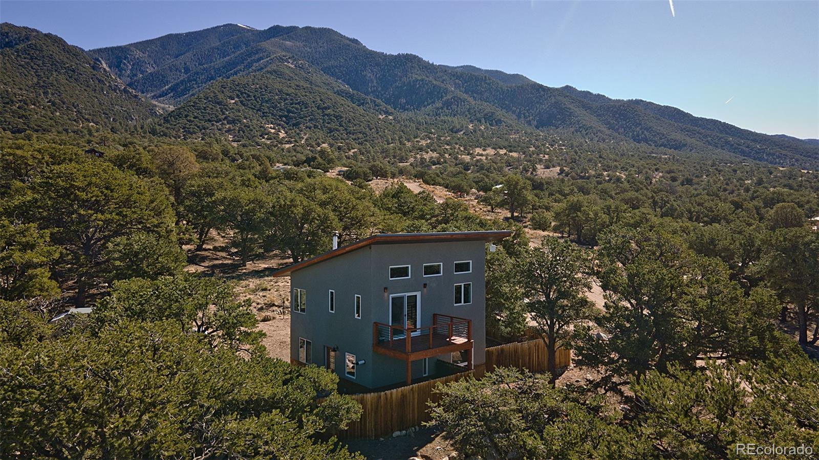 4352 Rarity Way Crestone, CO 81131 - Photo 2 of 49 a view of a house with a mountain in the background