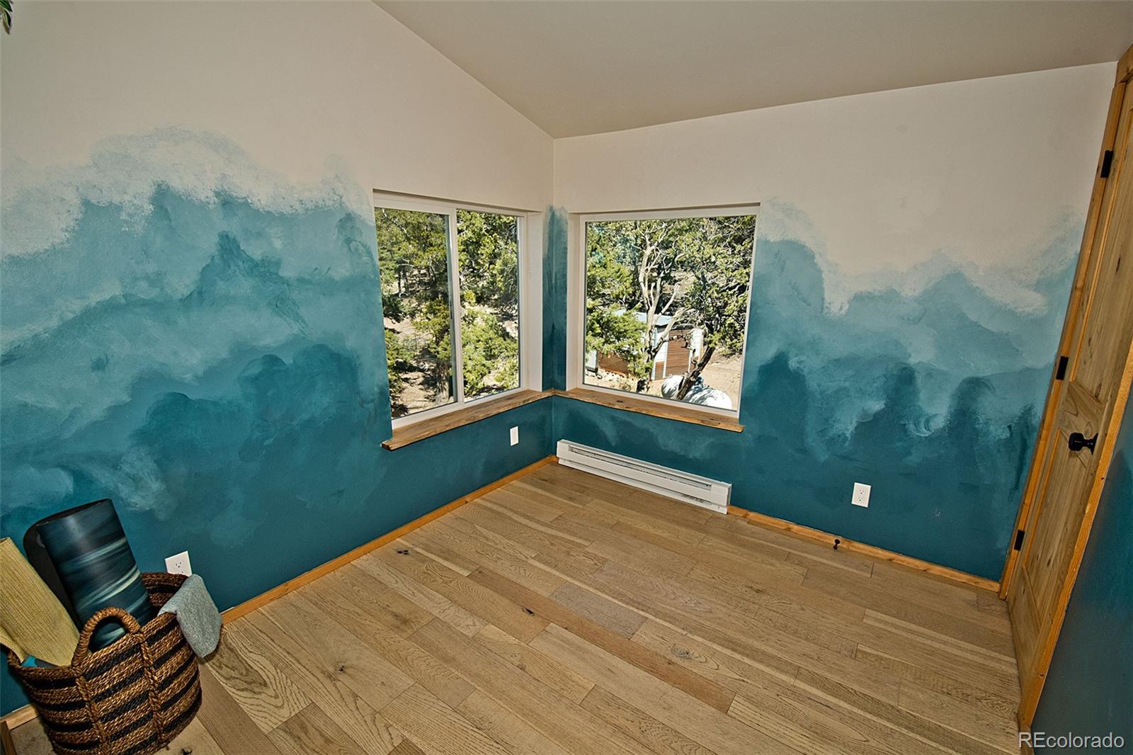 4352 Rarity Way Crestone, CO 81131 - Photo 23 of 49 a bedroom with a bed and a window
