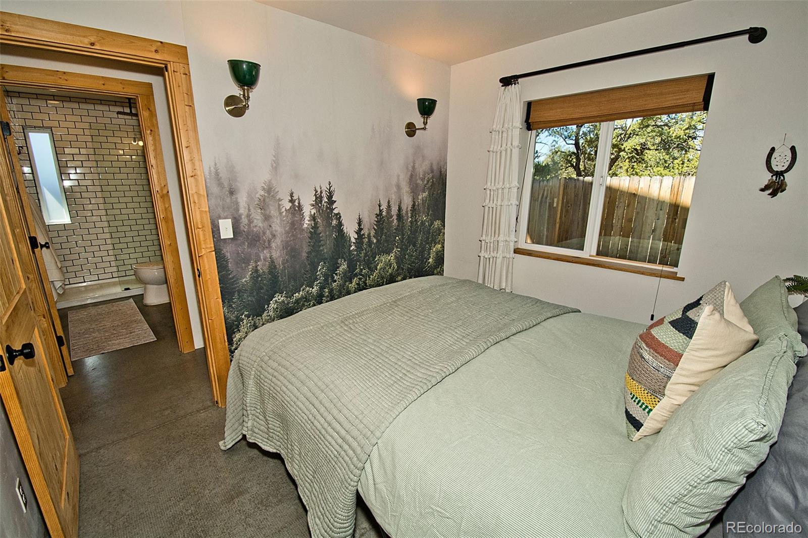 4352 Rarity Way Crestone, CO 81131 - Photo 34 of 49 a bed sitting in a bedroom next to a window