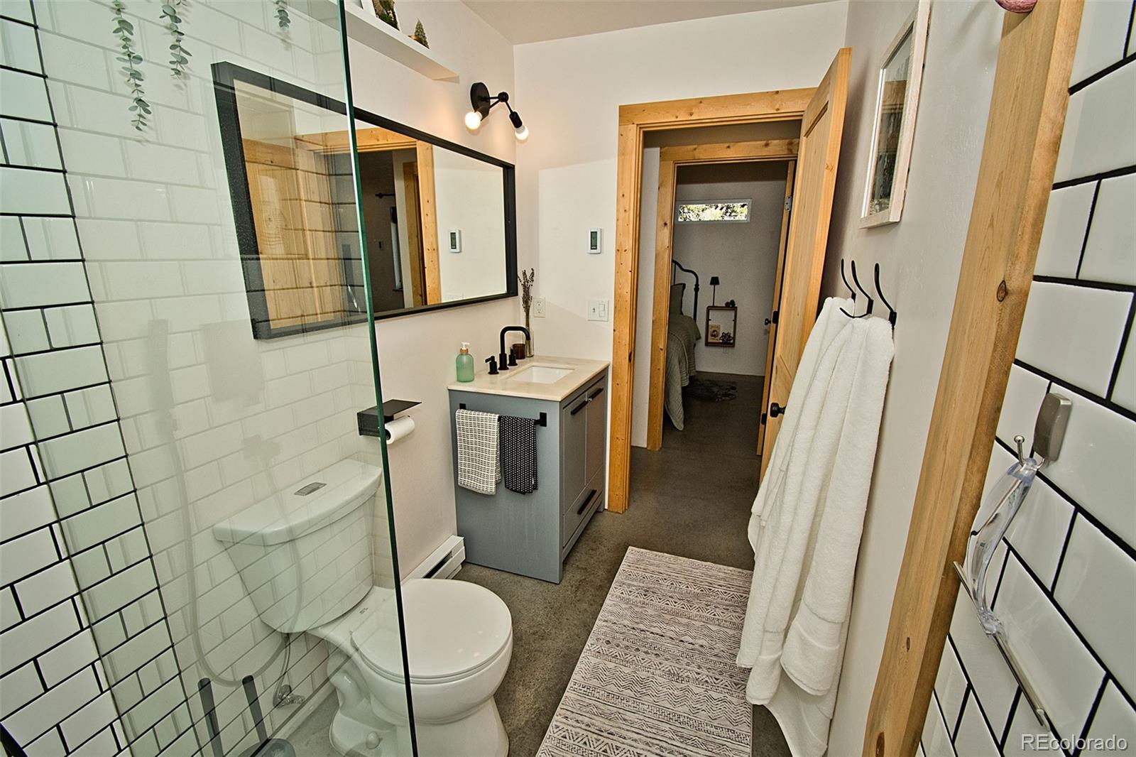 4352 Rarity Way Crestone, CO 81131 - Photo 36 of 49 a bathroom with sink shower and mirror