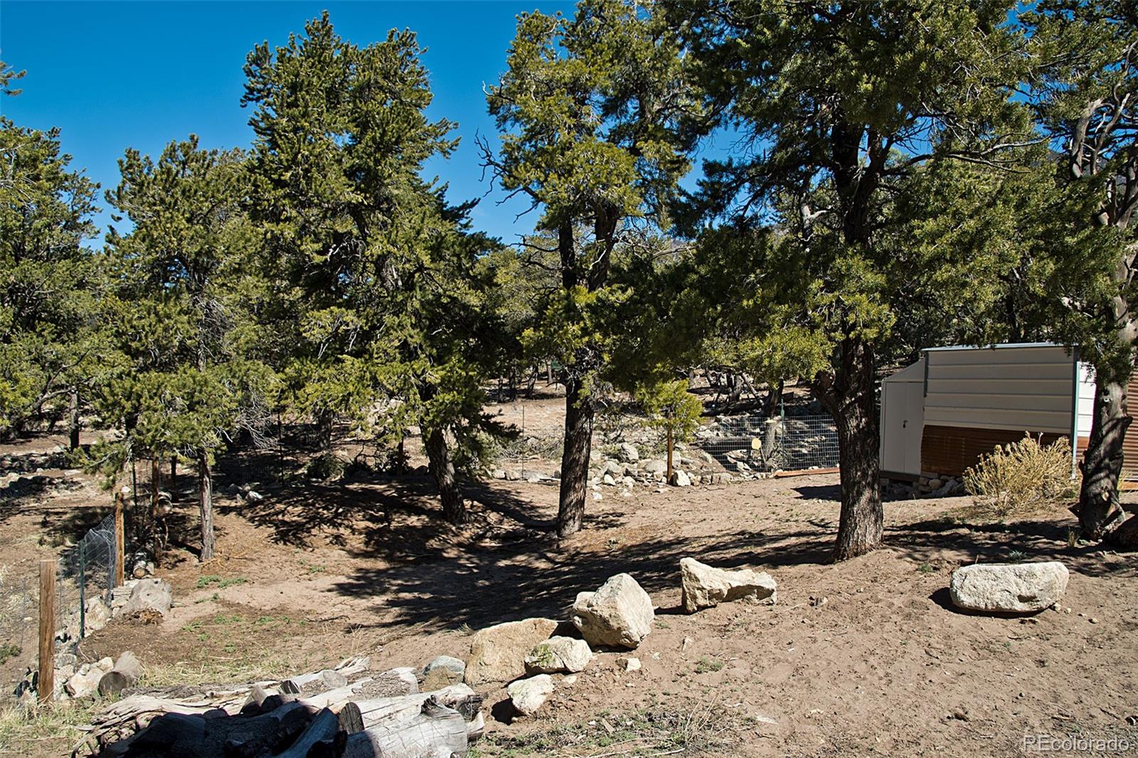 4352 Rarity Way Crestone, CO 81131 - Photo 43 of 49 a backyard of a house with lots of green space