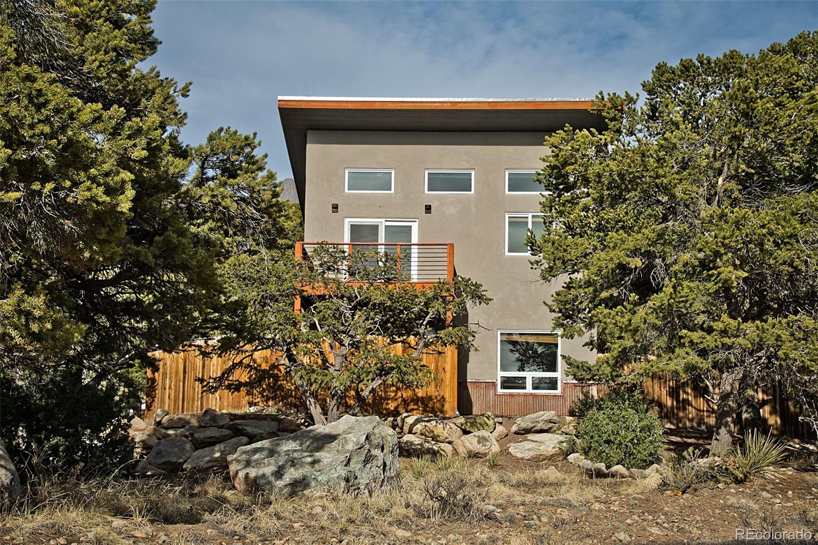 4352 Rarity Way Crestone, CO 81131 - Photo 5 of 49 a front view of a house with garden