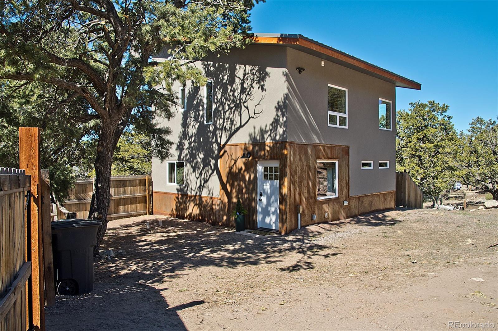 4352 Rarity Way Crestone, CO 81131 - Photo 7 of 49 a front view of a house with a yard