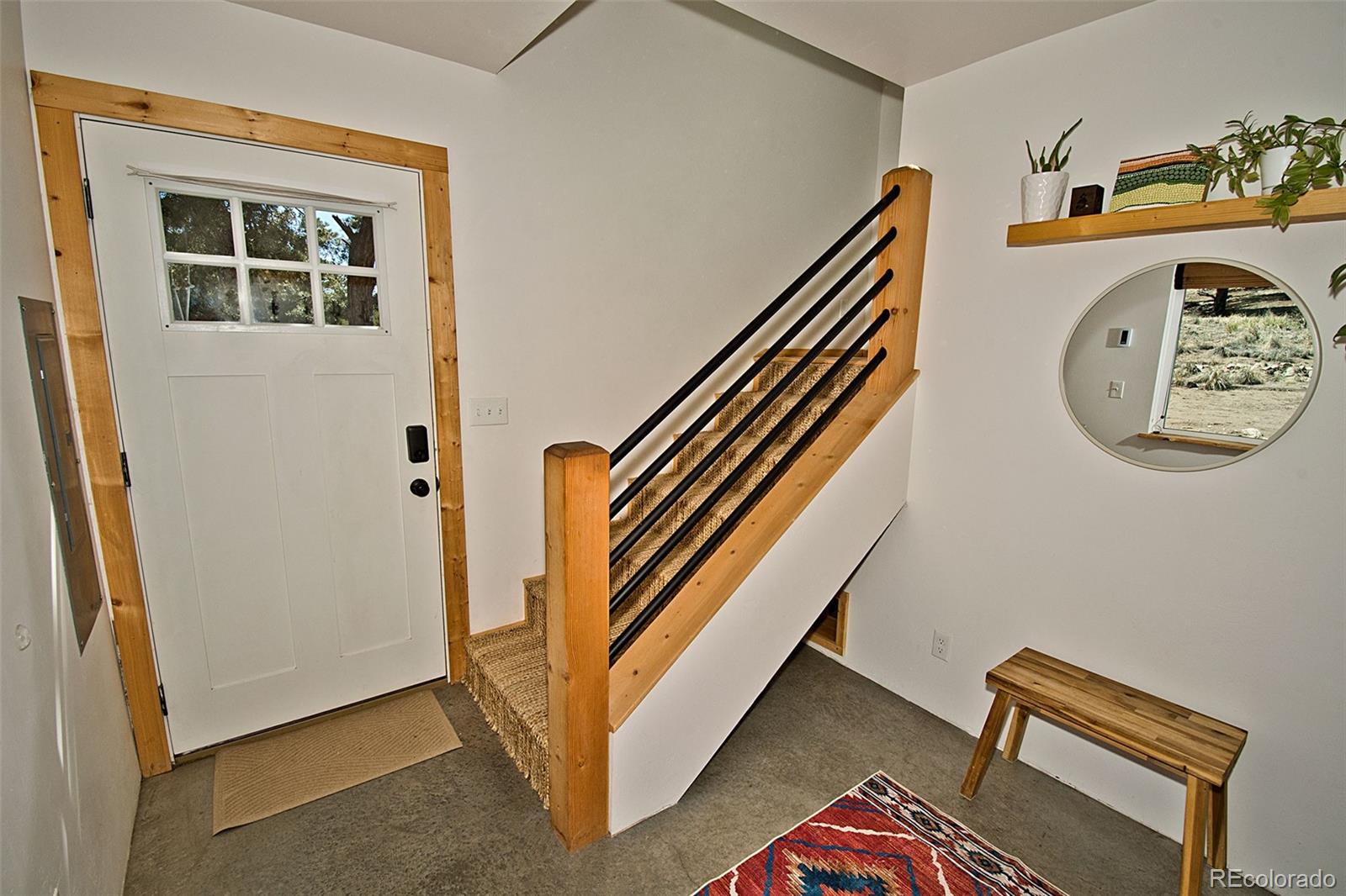 4352 Rarity Way Crestone, CO 81131 - Photo 10 of 49 a view of a hallway with entryway and stairs