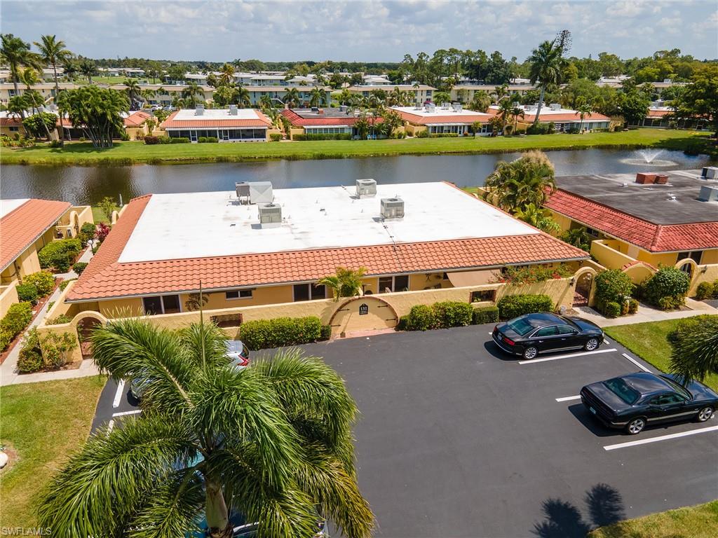 an aerial view of a house with a lake view