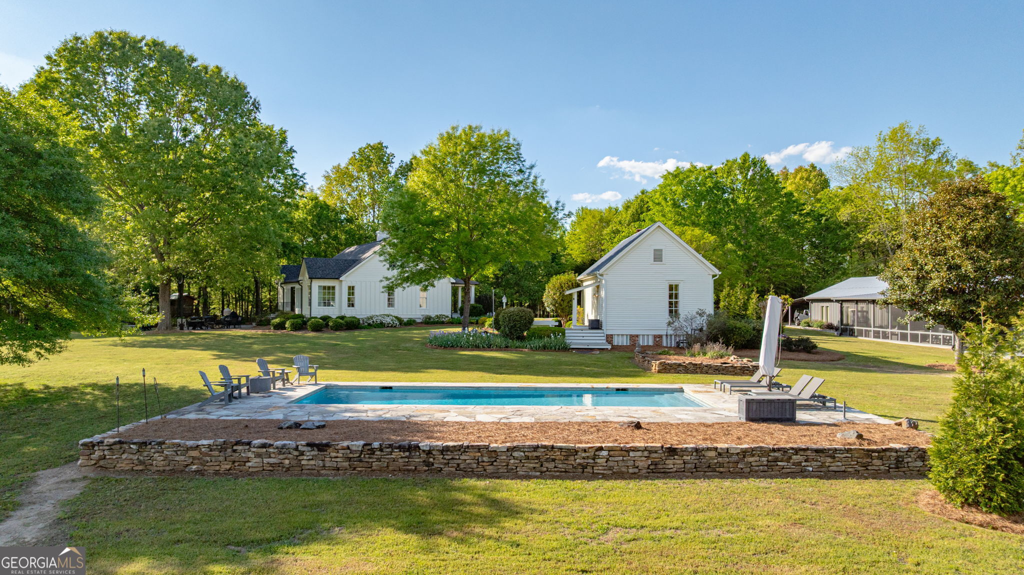 235 Glades Road Eatonton, GA 31024 - Photo 67 of 79 a house with swimming pool in front of it