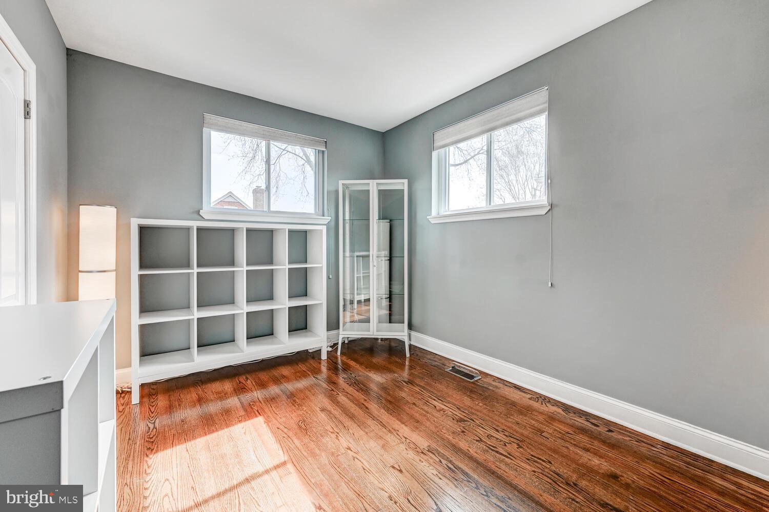 6420 Kenwood Avenue Rosedale, MD 21237 - Photo 13 of 22 a view of empty room with wooden floor and windows